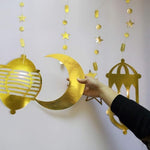 Aladdin theme birthday party setting utilizing the gold celestial star decorations as a photo backdrop.