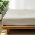 Side profile showing deep pocket fit on thick mattress