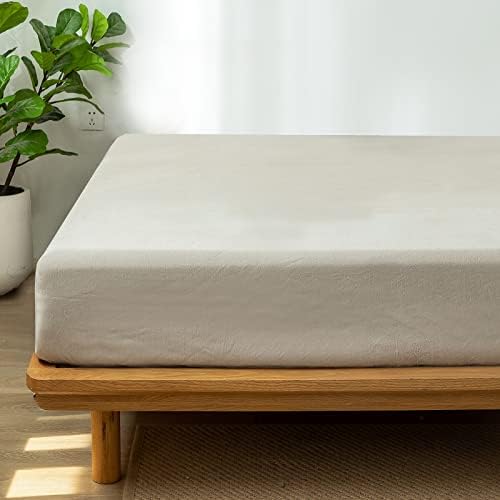 Side profile showing deep pocket fit on thick mattress