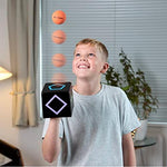 KOMBOID skill toy package contents showing the single tracking cube two yellow rubber balls and challenge cards