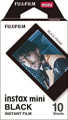Fujifilm Instax Mini credit card size film sheets displaying developed black and white images with sleek black borders