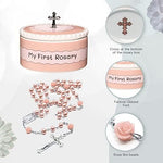 Close up of pink beaded baby rosary and cross keepsake box