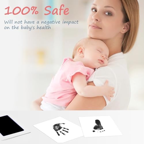 Detailed black baby handprint impression on white cardstock paper