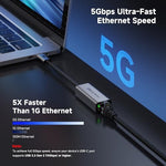 Cable Matters high speed network dongle plugged into a laptop showing the RJ45 Ethernet port connection.