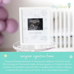 Gender neutral baby shower decor frame showing Best Gift Ever script and photo slot