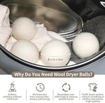 Extra large white organic wool balls showing the natural texture of premium fiber.