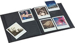 Open pages of the premium Polaroid storage book showing picture sleeves