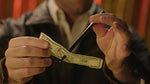 Magic Makers Pen Through Dollar illusion prop showing pen penetrating paper bill