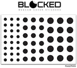 Demonstration of multiple BLOCKED vinyl privacy stickers stacked together for enhanced grip and easy removal
