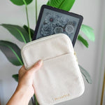 Flat lay of StickieTech cream corduroy travel sleeve