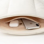 Comfyable puffer sling bag accessory pocket detail