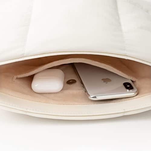 Comfyable puffer sling bag accessory pocket detail