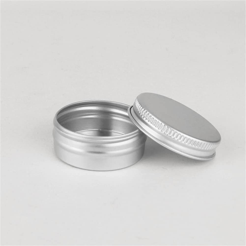 Wuiil metal tins displayed with screw cap lids removed.