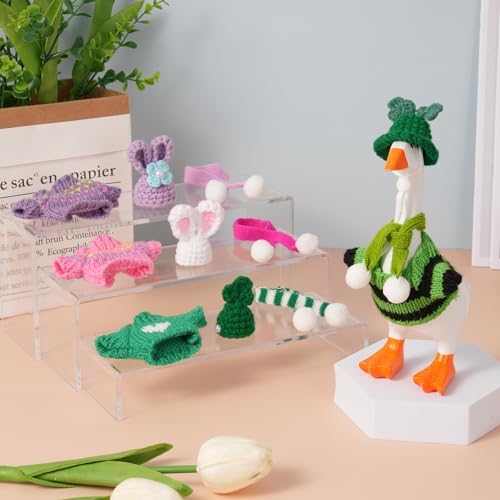 Stylized desk goose wearing knitted sweater and hat