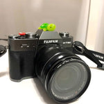 Close up view of decorative animal camera hot shoe cap shielding flash contacts from dust