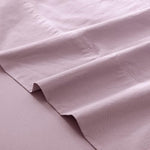 MooMee linen-like textured purple bed sheet styled neatly on a queen size bed.