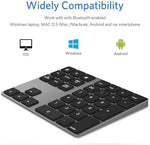 JOYEKY external wireless numpad angled view showing the premium ultra-slim profile and USB-C charging port setup