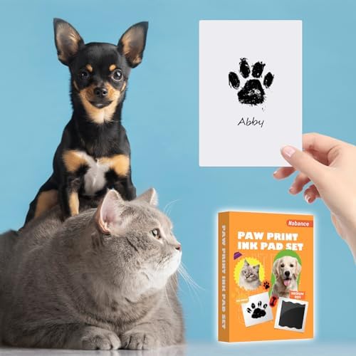 Clean touch ink pad being pressed by a dog paw to create an impression