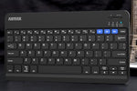 Arteck universal compact keyboard retail box contents including the micro USB charging cable and welcome manual.