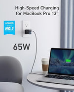 Anker GaN II sixty five watt charging block with premium foldable prongs half retracted to highlight maximum travel portability.