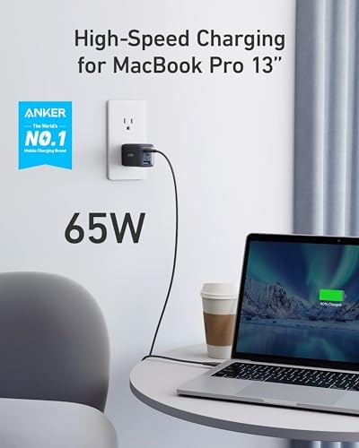 Anker GaN II sixty five watt charging block with premium foldable prongs half retracted to highlight maximum travel portability.