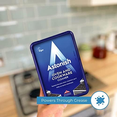 Eco friendly Astonish cookware cleaner being applied to a stained stainless steel pan interior.