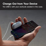 Beats Solo Buds matte black earbuds resting on a surface