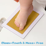 Six included imprint cards displayed alongside two gold stamp pads for scale
