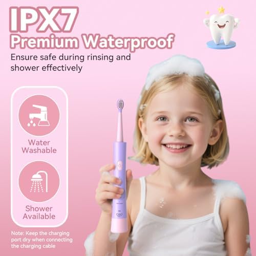Pink JTF kids electric toothbrush showing the smart timer and ergonomic handle grip.