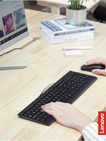 Lenovo spill resistant desktop input accessories viewed from an angled perspective