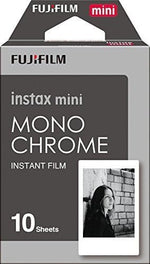 Black and white instant film sheets displaying high contrast artistic photography prints