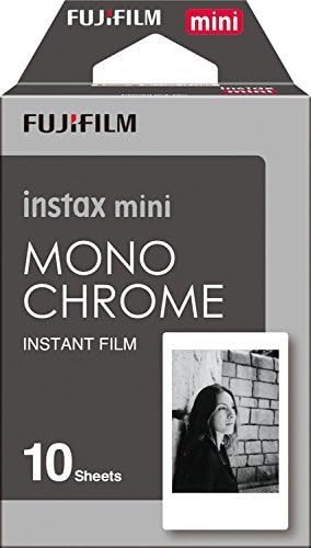 Black and white instant film sheets displaying high contrast artistic photography prints