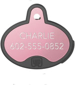 YIP Smart Tag custom engraved dog tracking device inside black silicone sleeve
