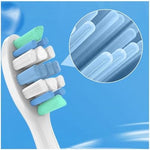 Close up of blue and green contoured bristles on electric toothbrush refill