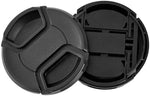 Two black 52mm snap-on camera lens covers displayed alongside four elastic lens cap keeper tethers