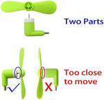 Pocket sized mobile accessory fan disassembled into two pieces showing convenient travel friendly design.