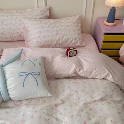 Demonstration of the reversible side showing the classic pink and white vertical stripes pattern.