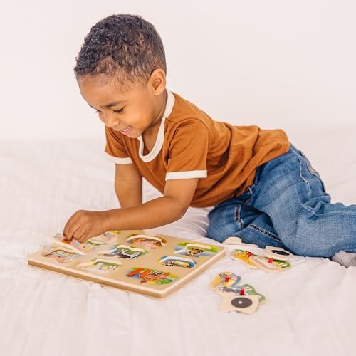 Close up of Melissa & Doug wooden peg puzzle pieces for toddlers