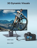 JSAUX travel friendly micro converter demonstrating its compact size alongside action camera accessories.