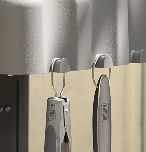 Weber stainless steel barbecue utensils laid out flat