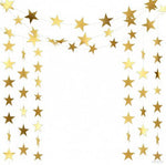 Double sided reflective paper star streamers draped elegantly across a white living room ceiling.