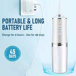 Houscly dental flosser showing 300ml detachable water tank and charging port.
