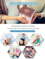 Open baby teeth storage box with compartments and tweezers