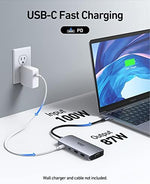 Selore triple monitor hub showing peripheral USB ports for external keyboard and mouse connections.