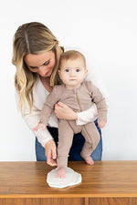 Close up view of the non toxic air dry clay disc capturing fine baby footprint details.
