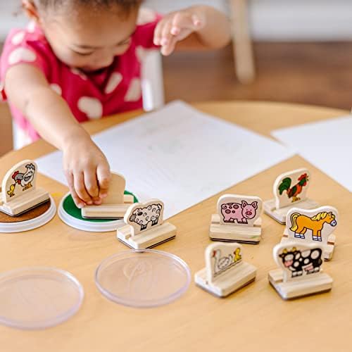 Close up of farm animal stamp impressions on white paper