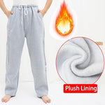 Zippered pocket detail showing hidden urine bag storage on catheter pants