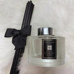 Jo Malone Red Roses diffuser staged in a modern living room interior