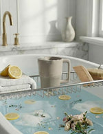 Side angle of the taupe Roslim baby bath cup highlighting the flexible silicone body.