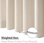 Water droplets smoothly beading up on the water repellent surface of the thick luxury bath curtain.